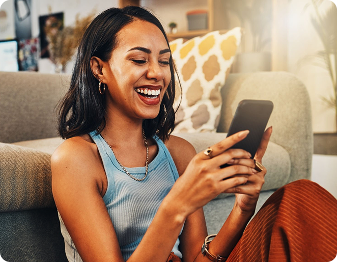 Woman smiling while using the UnifyWell app on her phone