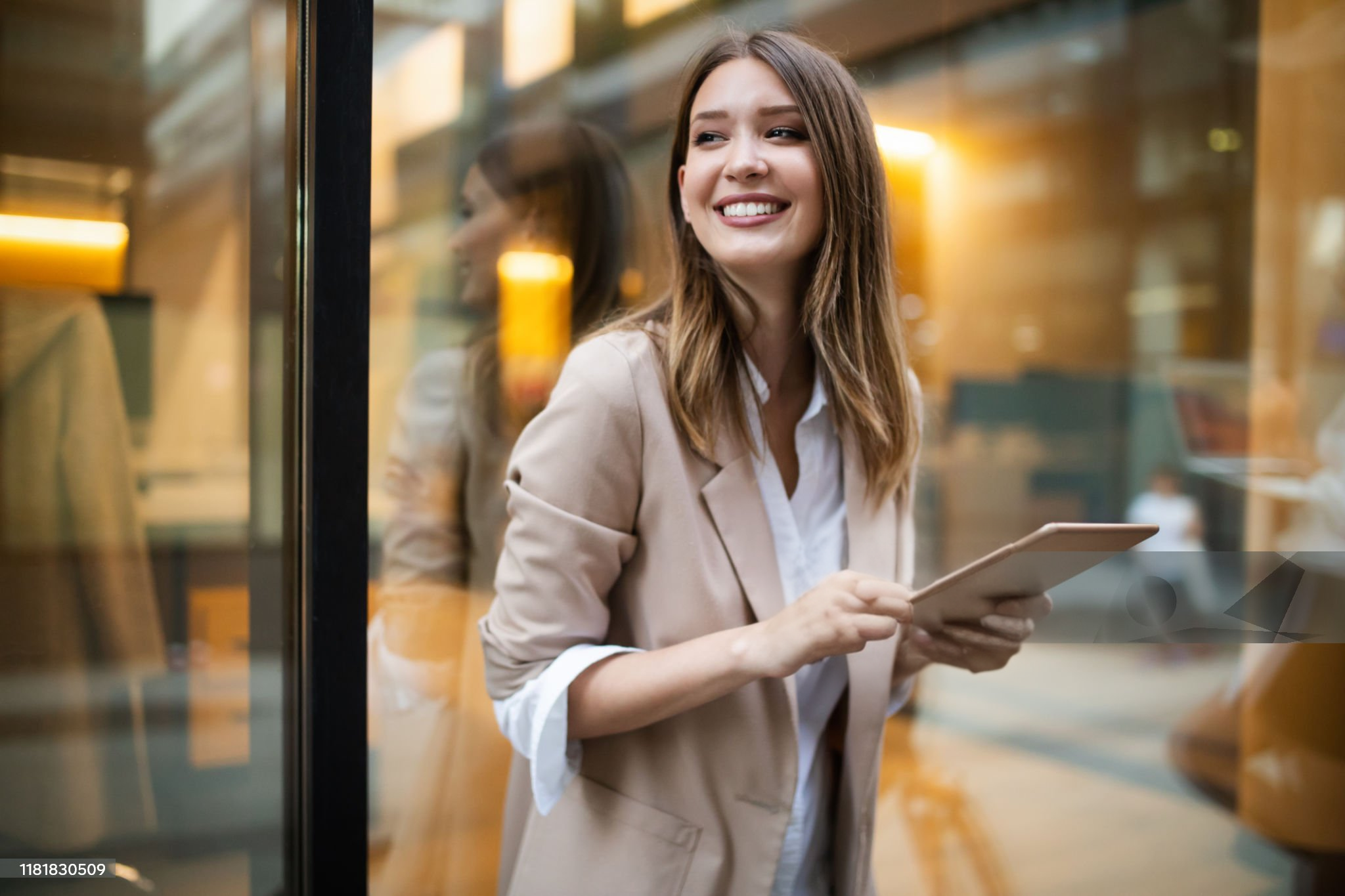 Smiling professional holding a tablet